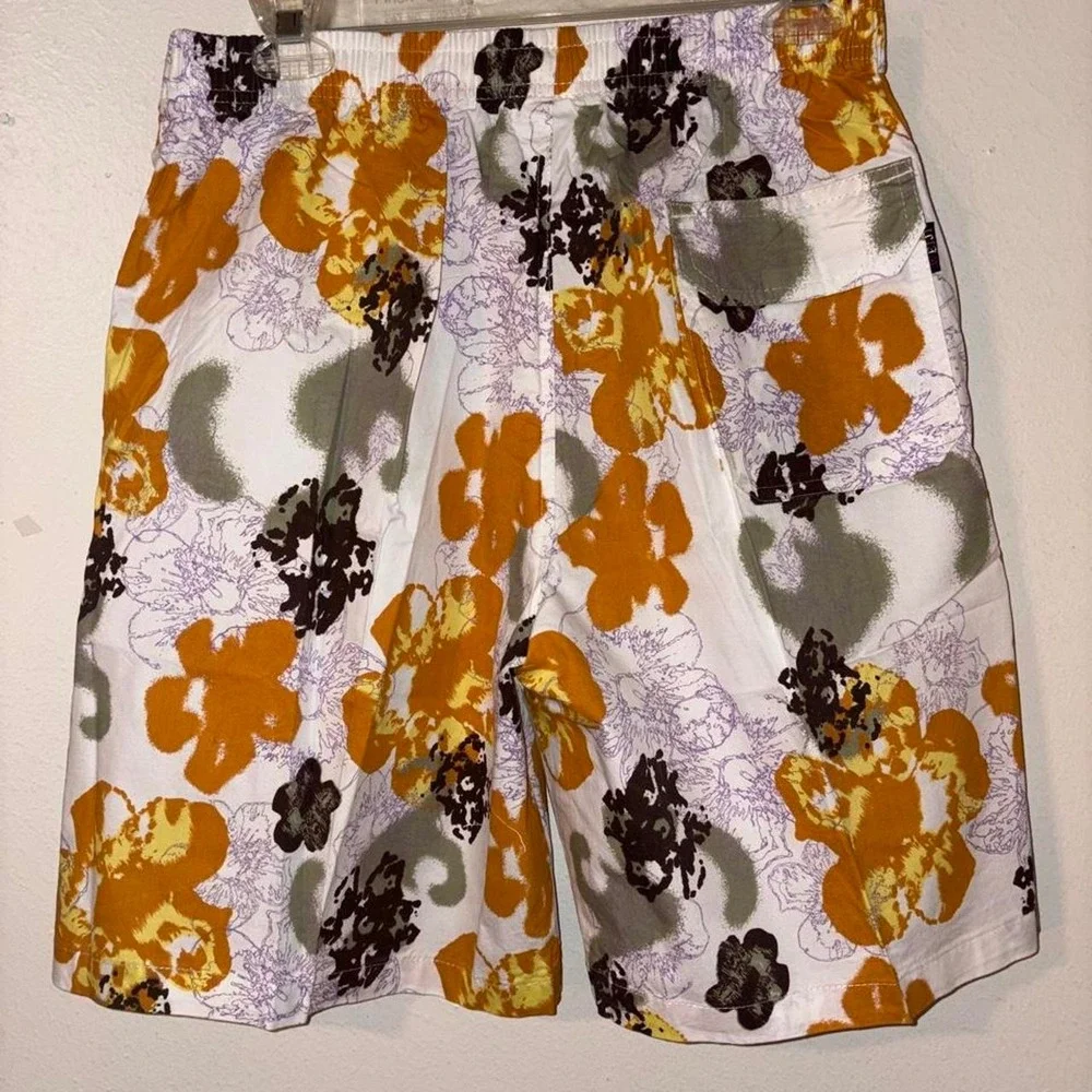 Swim Shorts Orange, black, and purple floral print swim trunks #swimwear #floral